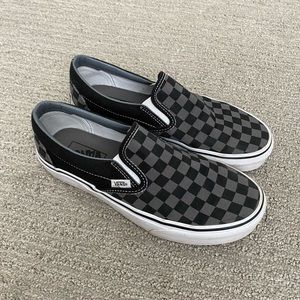 Black and grey checkered slip-on Vans